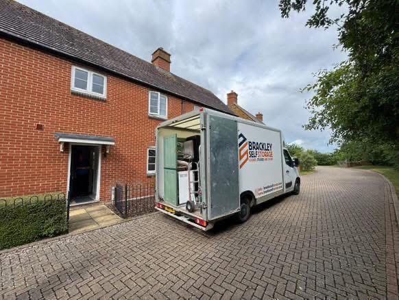 Brackley Self Storage removal van outside a brick house